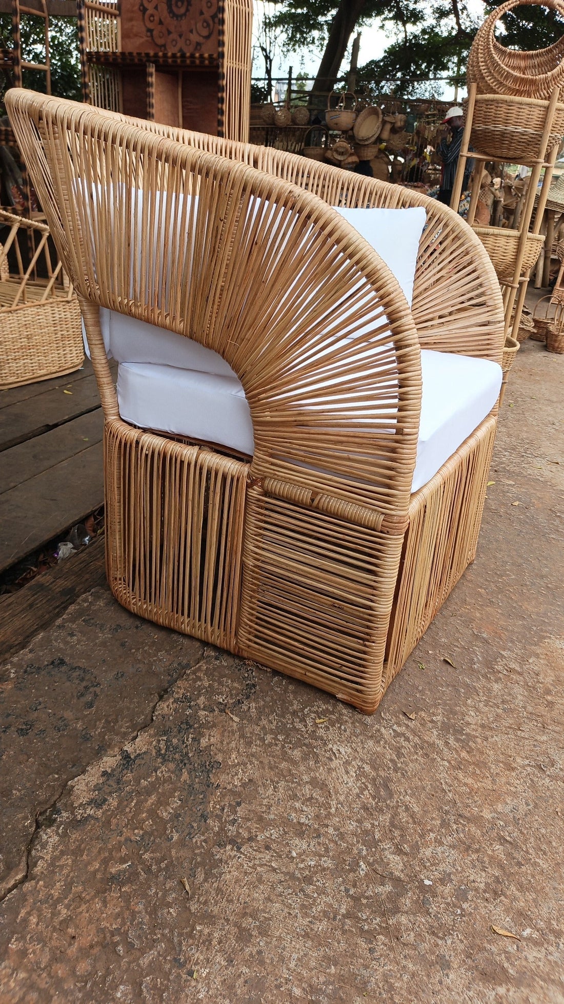 hand-woven rattan armchair would be suitable on a veranda with perfect sea view. 